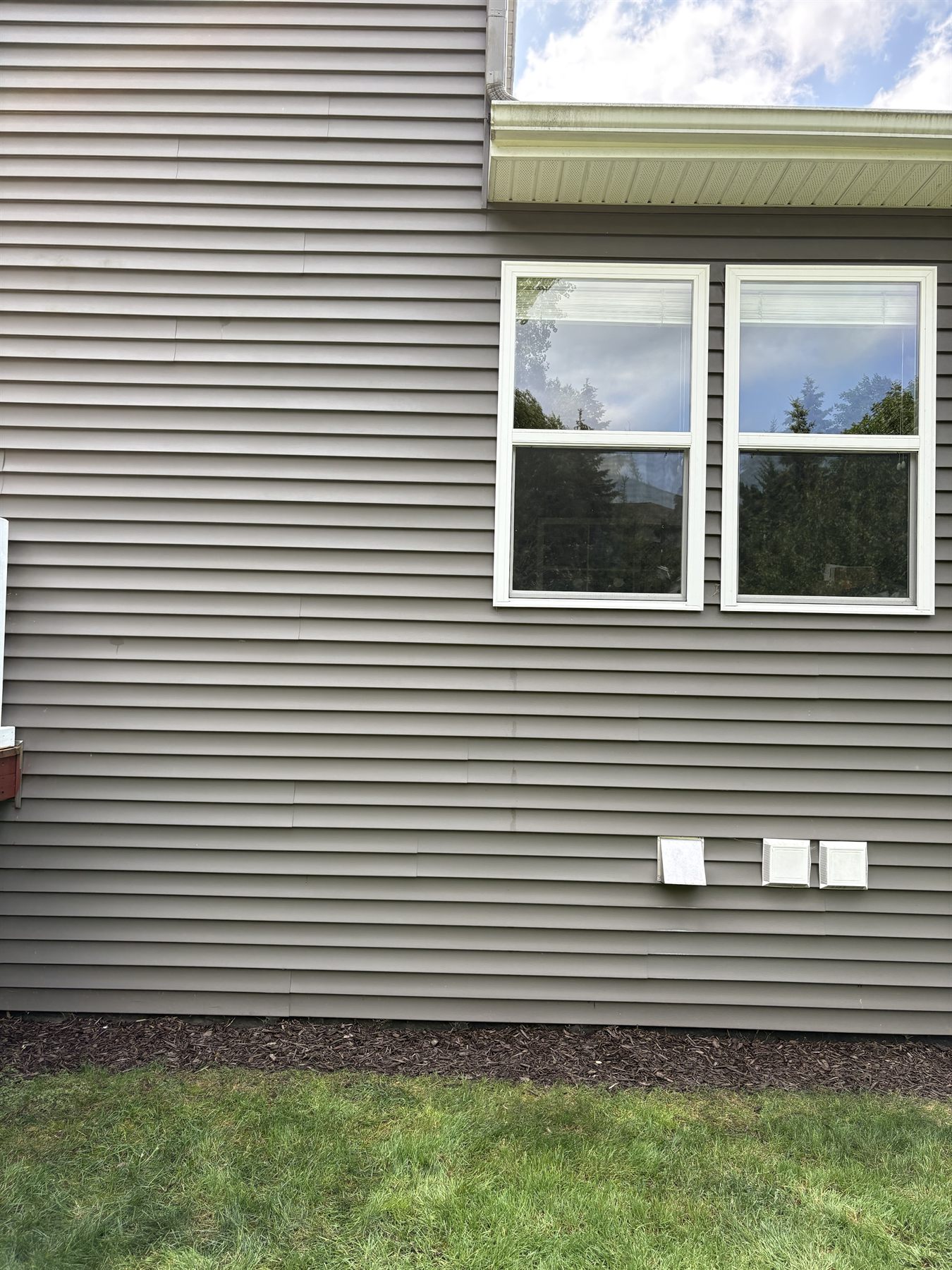 The same siding after pressure washing