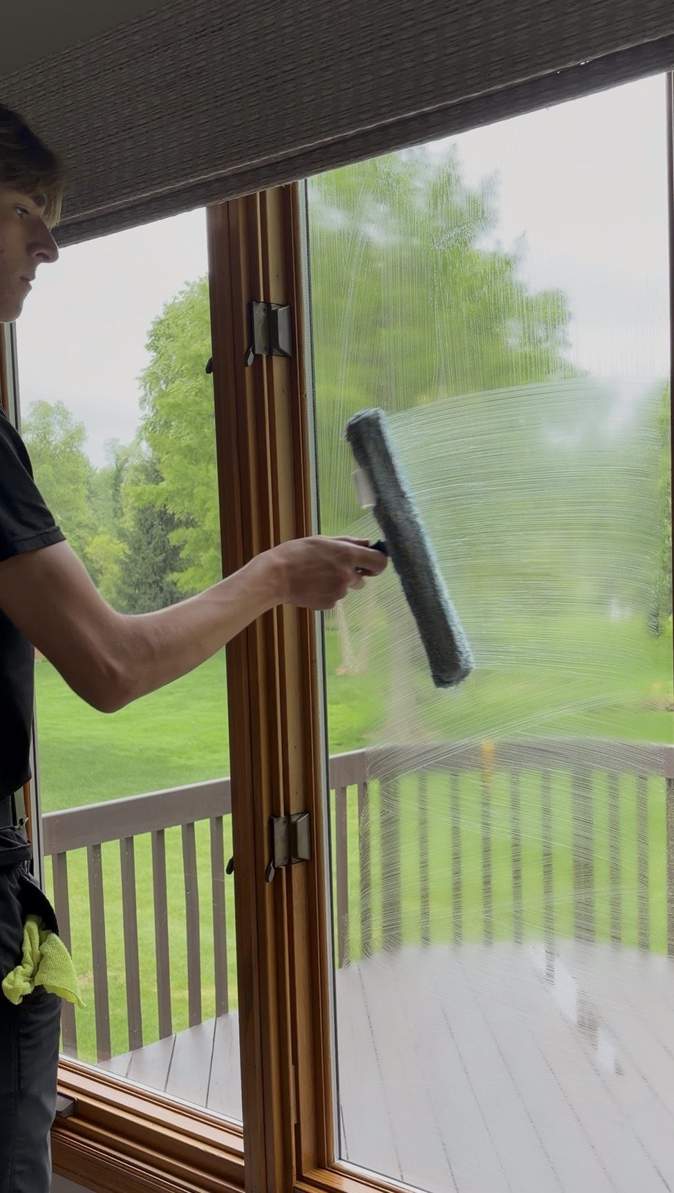 Squeegeeing a sudsy window